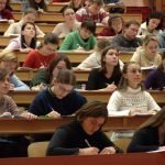 college students seated in a lecture theatre