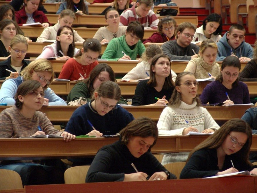 college students seated in a lecture theatre
