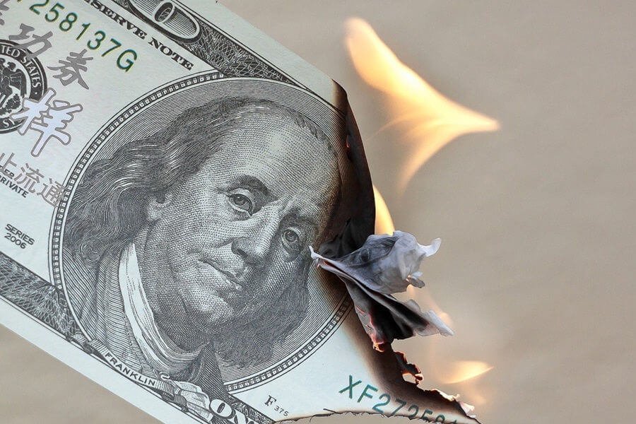 reserve note burning, symbolising eroding value due to inflation